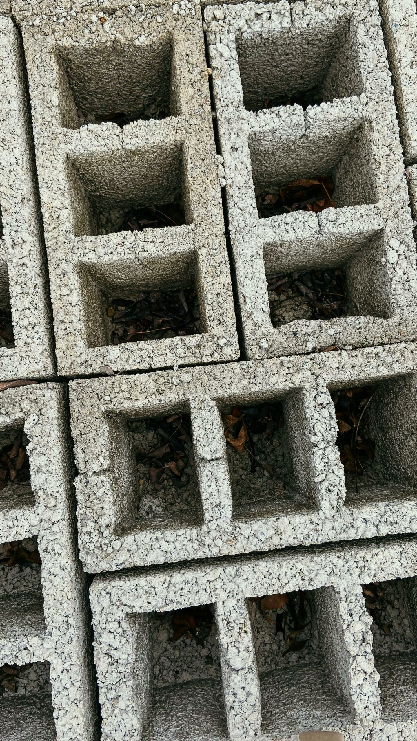 Detailed view of stacked concrete blocks showcasing texture and pattern, perfect for construction themes.